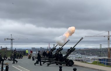 A blank is being fired from a canon ball at Citadel Hill and troops are gathered in order to salute Victoria Day.