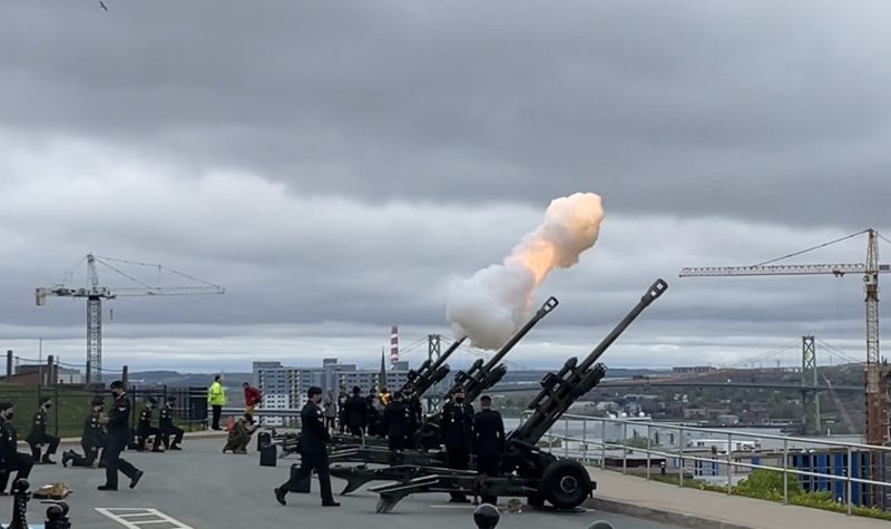 A blank is being fired from a canon ball at Citadel Hill and troops are gathered in order to salute Victoria Day.