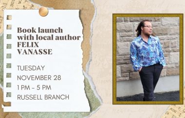 A young man with long hair pulled back, wearing a blue shirt and dark slacks, stands in front of a stone wall. To the left is a notice which says Book Launch with local author Felix Vanasse, Tuesday November 28, 1 pm - 5 pm, Russell Branch.