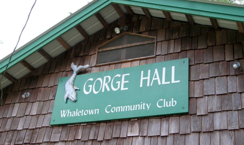 A green sign for the Gorge Hall.