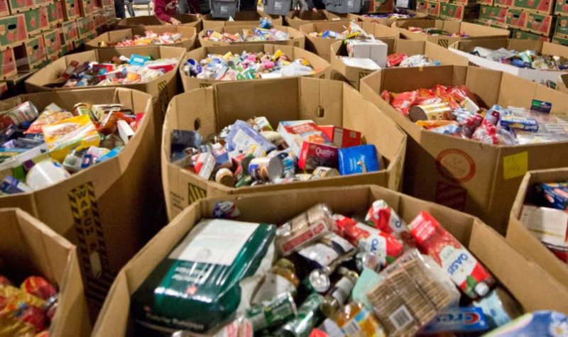 Numerous cardboard boxes filled with food items.