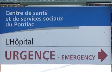 The sign at the Pontiac Hospital in Shawville, with blue and white background and a large emergency sign at the bottom.