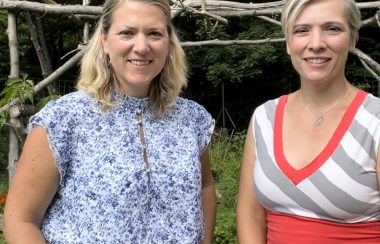 Picture is Jessica Brown and Amy Brown standing side by side outdoors.