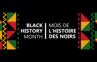Black History Month is written in white text on a black background with pan-African colours on either side of the text.