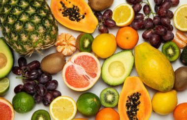 A photo with various fruits on a white background.