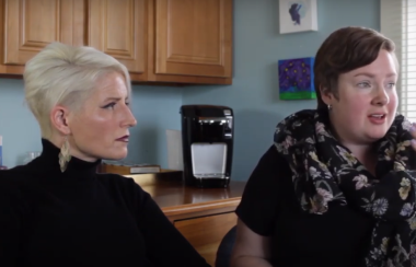 Krista Royama and Marie Reinsborough-Wadden sit side by side in an office.