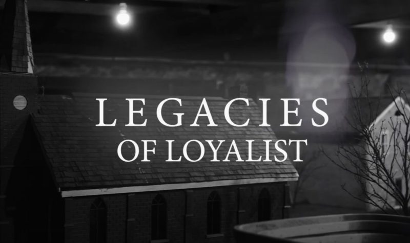 Cover Image from Legacies of Loyalist Film. Black and White photo of church and city lights in background.