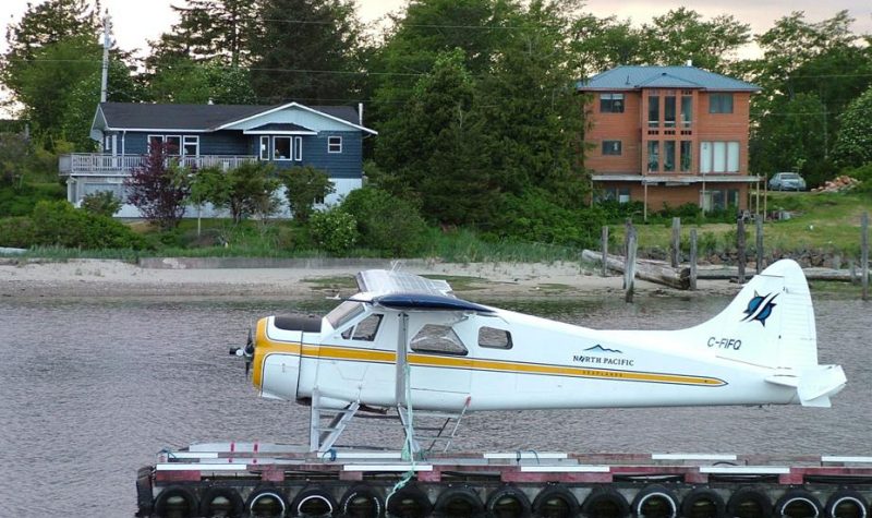 A floatplane waits on a dock on the water outside of the town of Masset on Haida Gwaii.