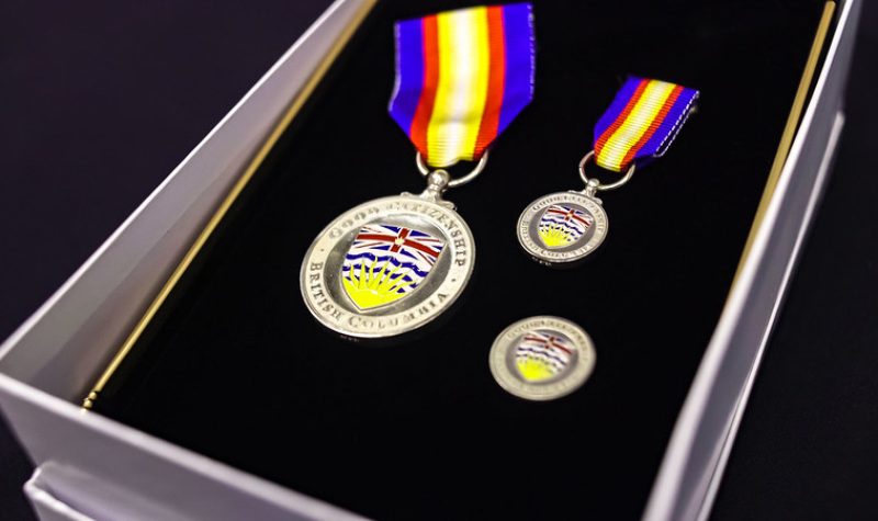 a case with medals with the flag of British Columbia