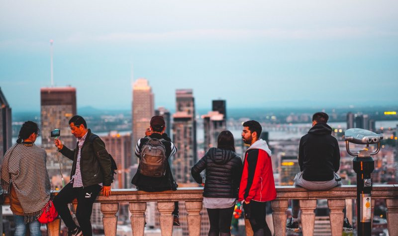 People view the Montreal skyline from a lookout atop Mount Royal.