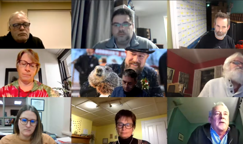 screen cap of a video conference, with 3X3 grid of faces