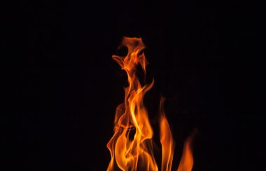 A stock photo of flames against a black background