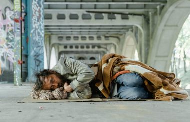 Homeless man lying on the ground