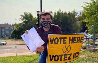 Returning student Rohin Minocha-McKenney with his letter from Mount Allison confirming his residence in Sackville. Minocha-McKenney says he tried four times to vote, and finally succeeded on his last try. Photo: contributed