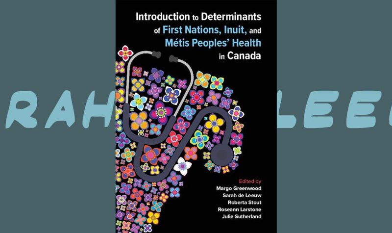 a textbook with a quilted fabric around a stethoscope is the cover of a textbook about Indigenous health