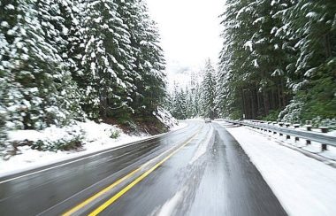 A highway is shown in the middle of winter.