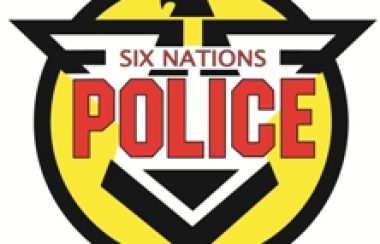 Six Nations Police logo on white background, with yellow, black, red and white colours.