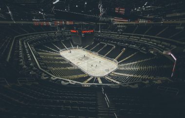 empty arena with players on the ice