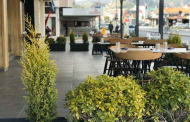 A row of tables outside a restaurant