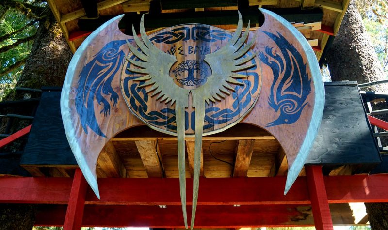 a homemade wooden and metal sign hangs above main stage at ValhallaFest in Terrace, BC