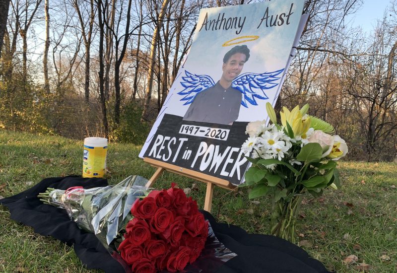 A photo of a sign commemorating Anthony Aust at an outdoor vigil on Nov. 8.